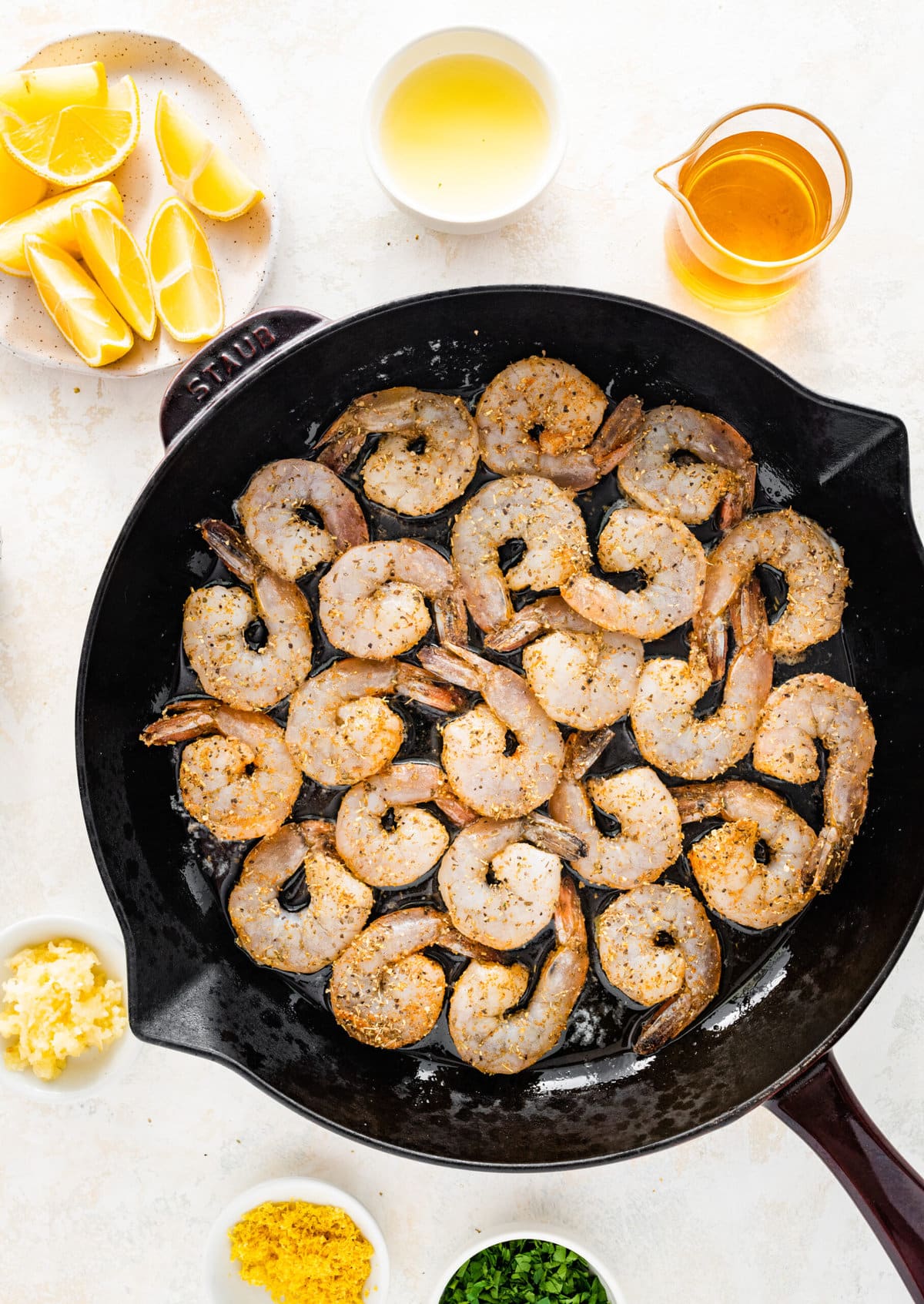 How to make easy pan seared shrimp step-by-step: adding the shrimp to the hot skillet.