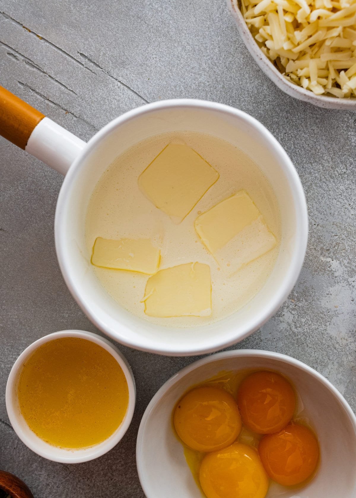 How to make duchess potatoes step-by-step: melting the butter in the pan.