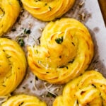 Duchess potatoes on parchment paper.