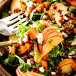 fork taking a bite of the harvest salad.