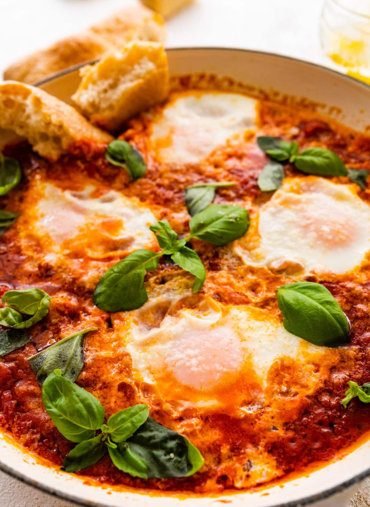 Skillet of Italian eggs in purgatory with bread.