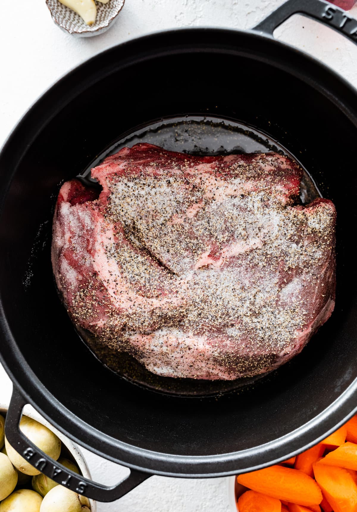 How to make the best perfect pot roast: brown the meat on both sides in a pot.