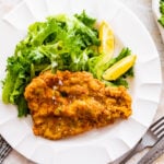 plate pork chop with green salad ready to eat.