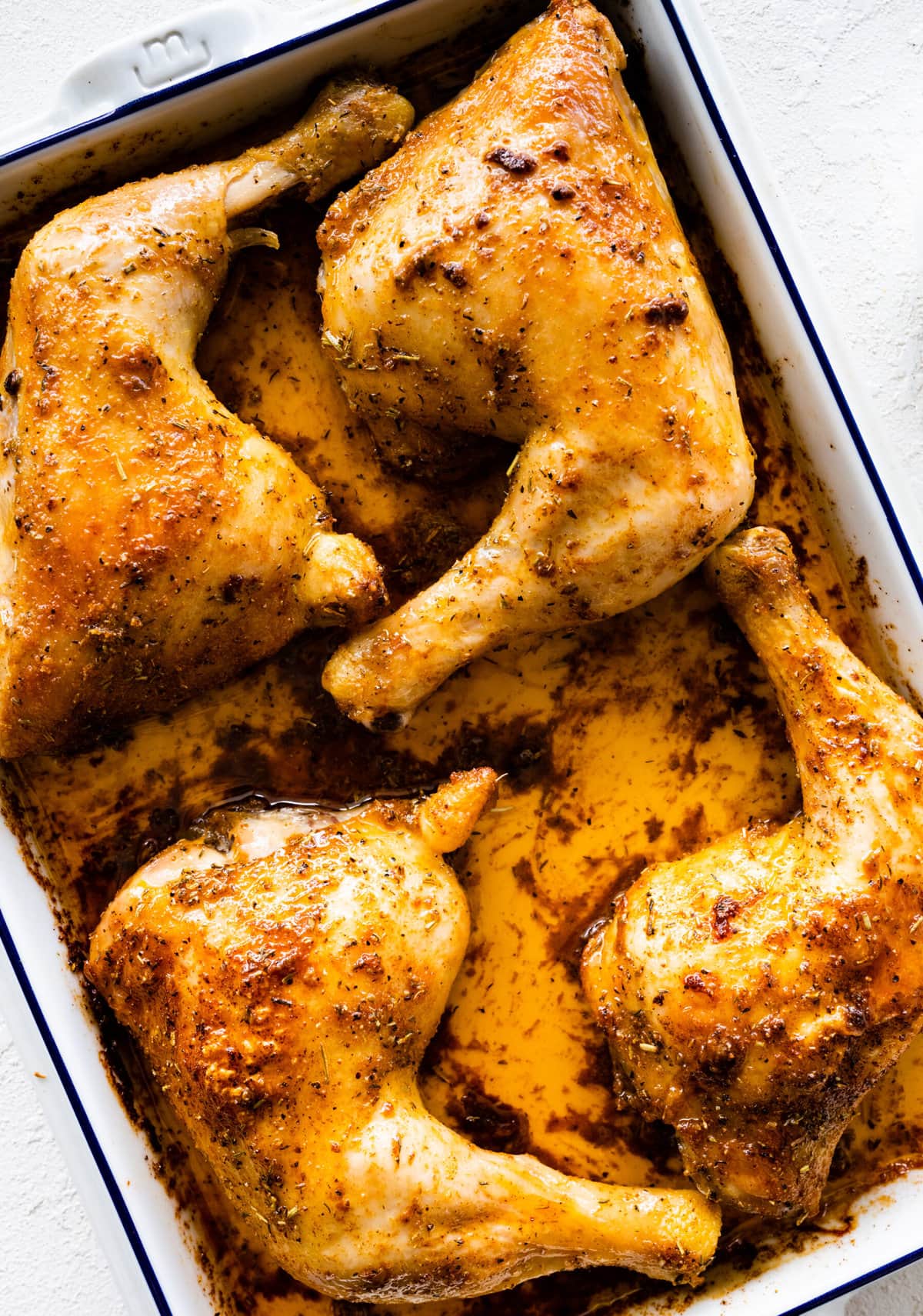 How to make easy baked chicken leg quarters step-by-step instructions: baking the chicken.