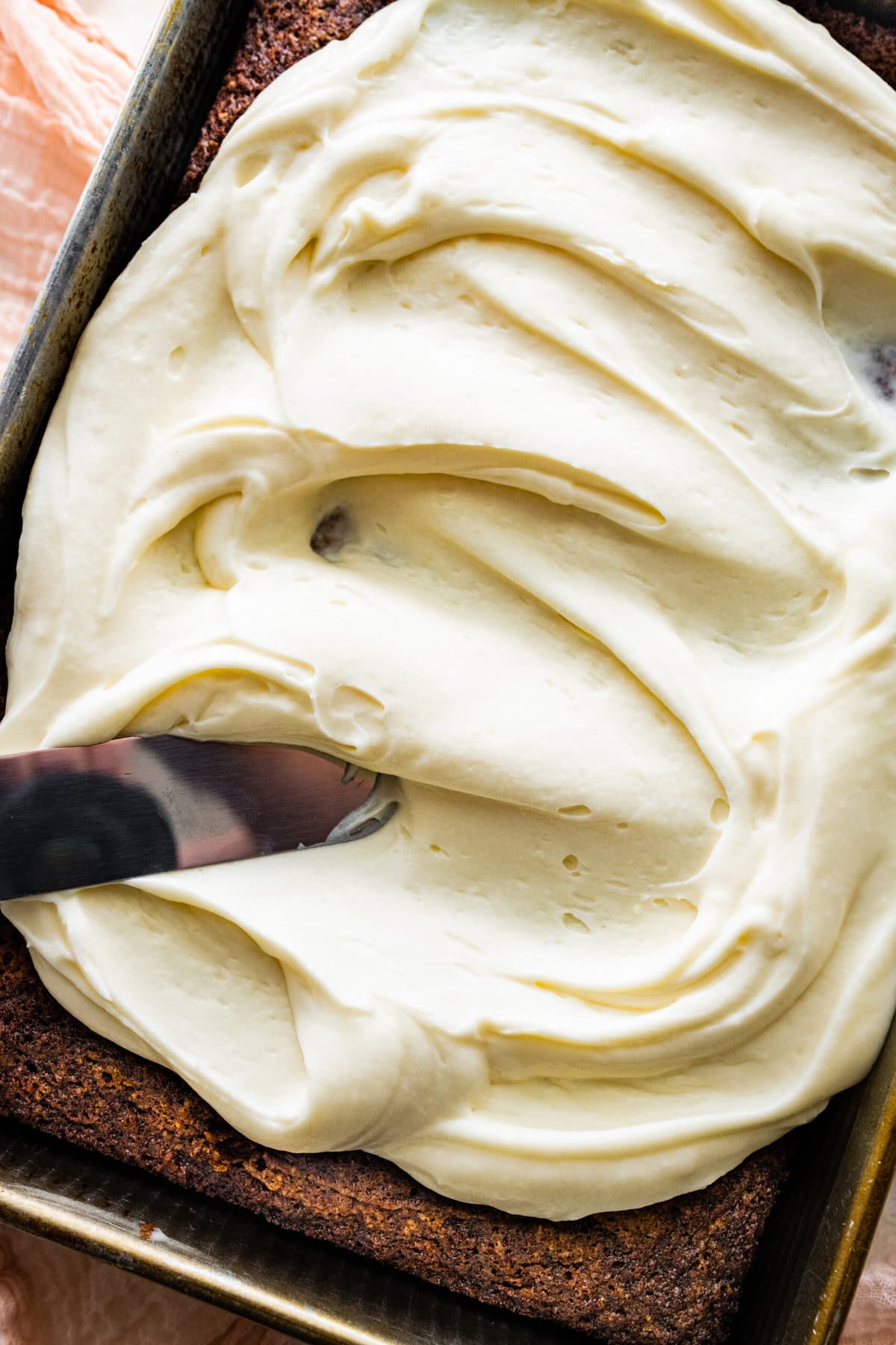 add the cream cheese frosting to the cooled cake.