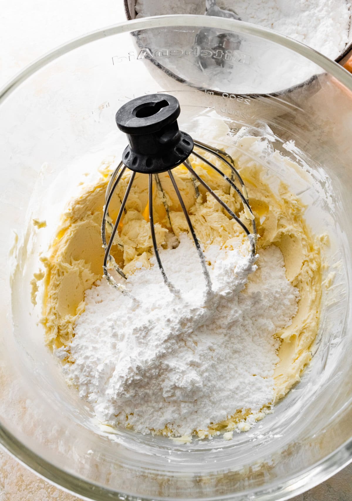 How to make cream cheese frosting step-by-step photos: adding all the frosting ingredients to the bowl.