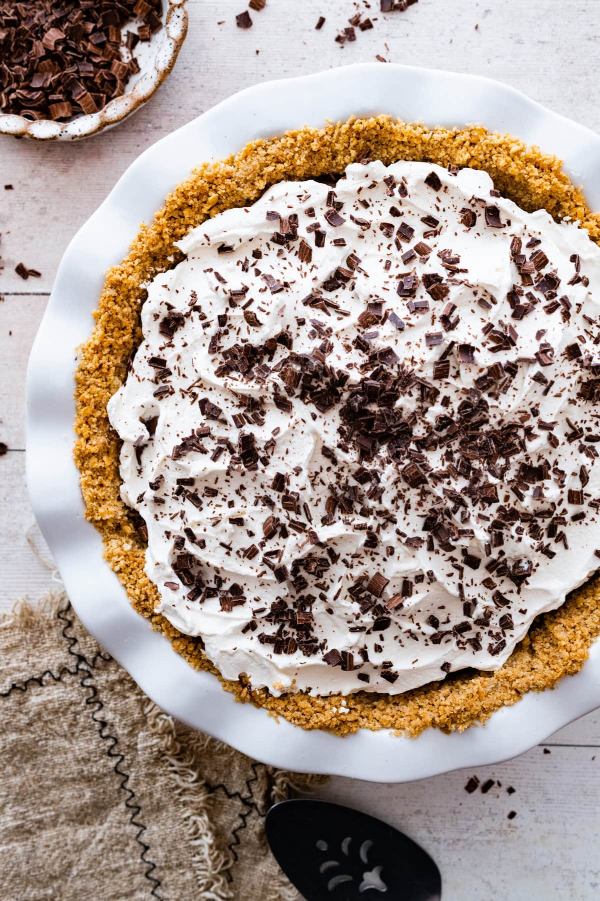 topping the pie with chocolate shaving and ready to serve.