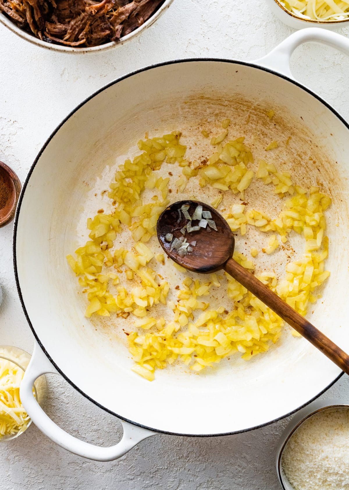 How to make leftover pot roast casserole step-by-step instructions: sauté onions in a pan.