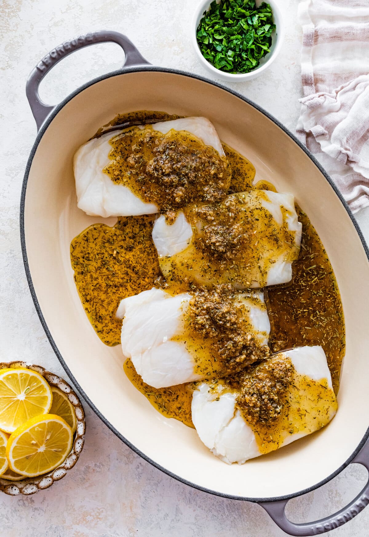 How to make easy oven baked cod step-by-step instructions: pour the marinade over the cod.