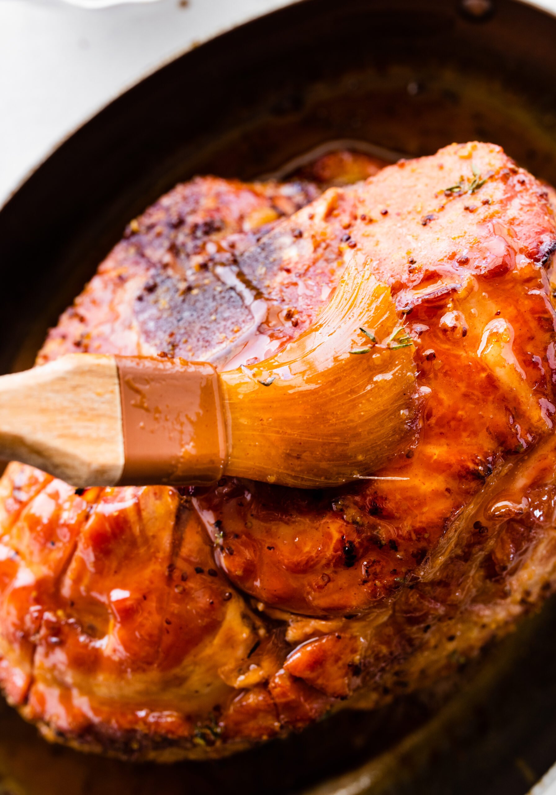 How to make baked ham with brown sugar glaze step-by-step: take foil off ham and top with glaze and bake again. Glaze the ham.