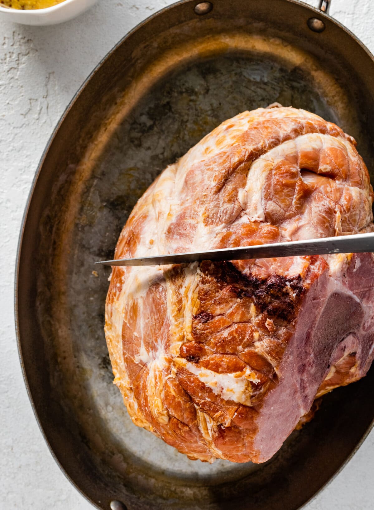 How to make baked ham with brown sugar glaze step-by-step: scoring the ham.