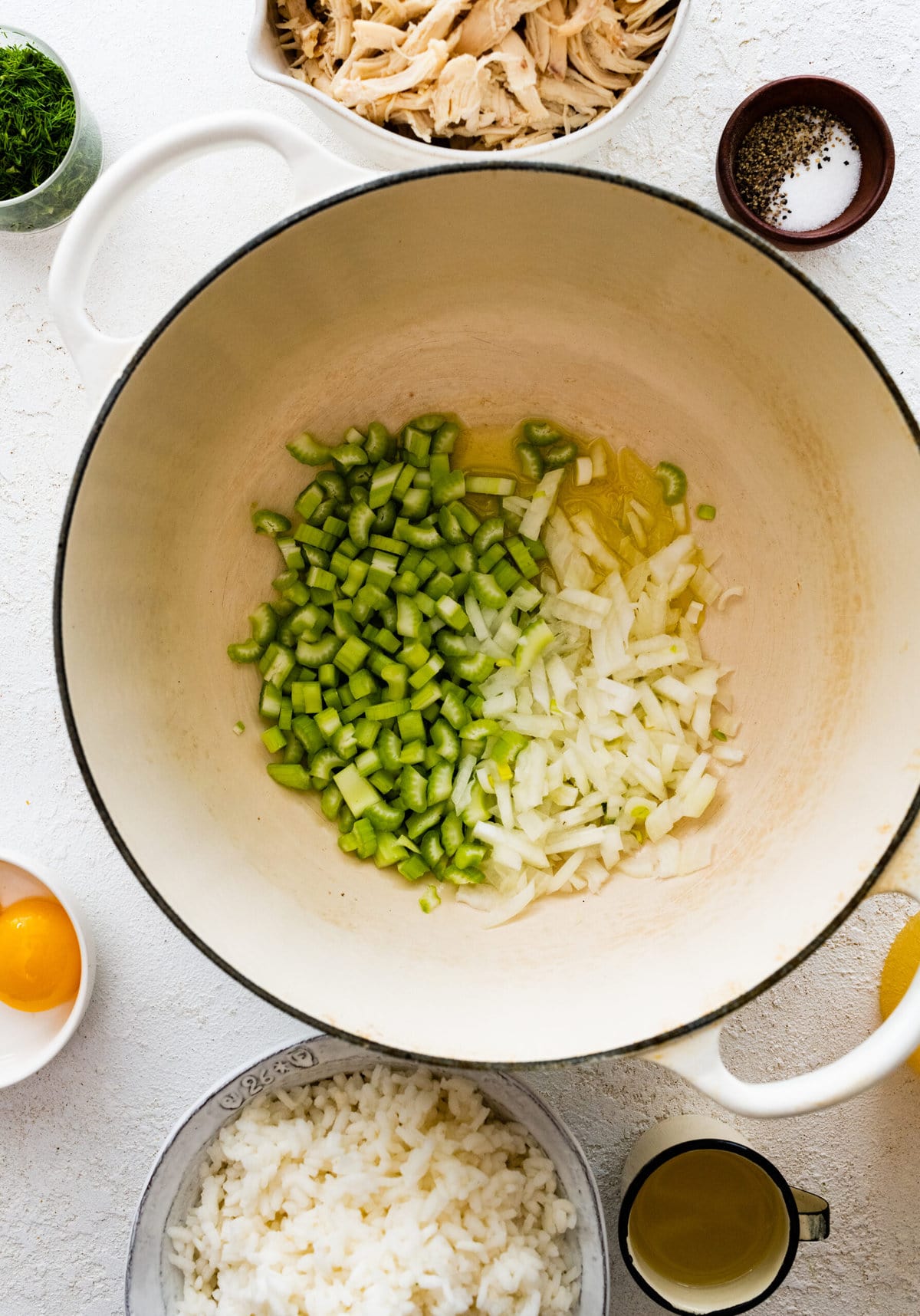 How to make best avgolemono soup step-by-step: saute onions and celery in a pot.