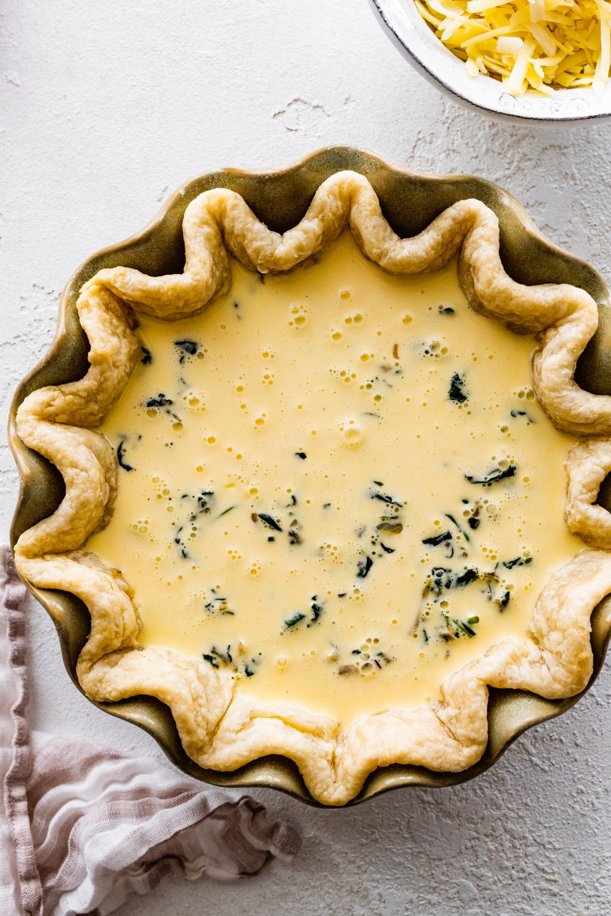 How to make spinach quiche step-by-step: quiche before baking