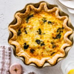 baked spinach quiche recipe out of the oven with golden brown top.