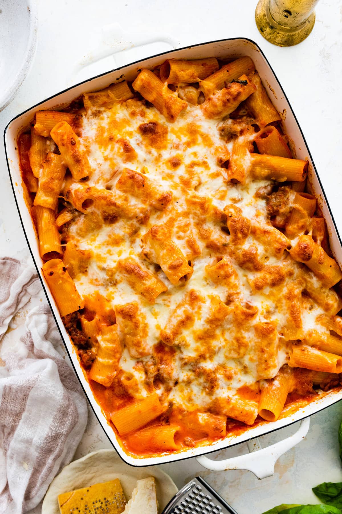 baked cheesy classic pasta al forno recipe out of the oven in a white baking pan.