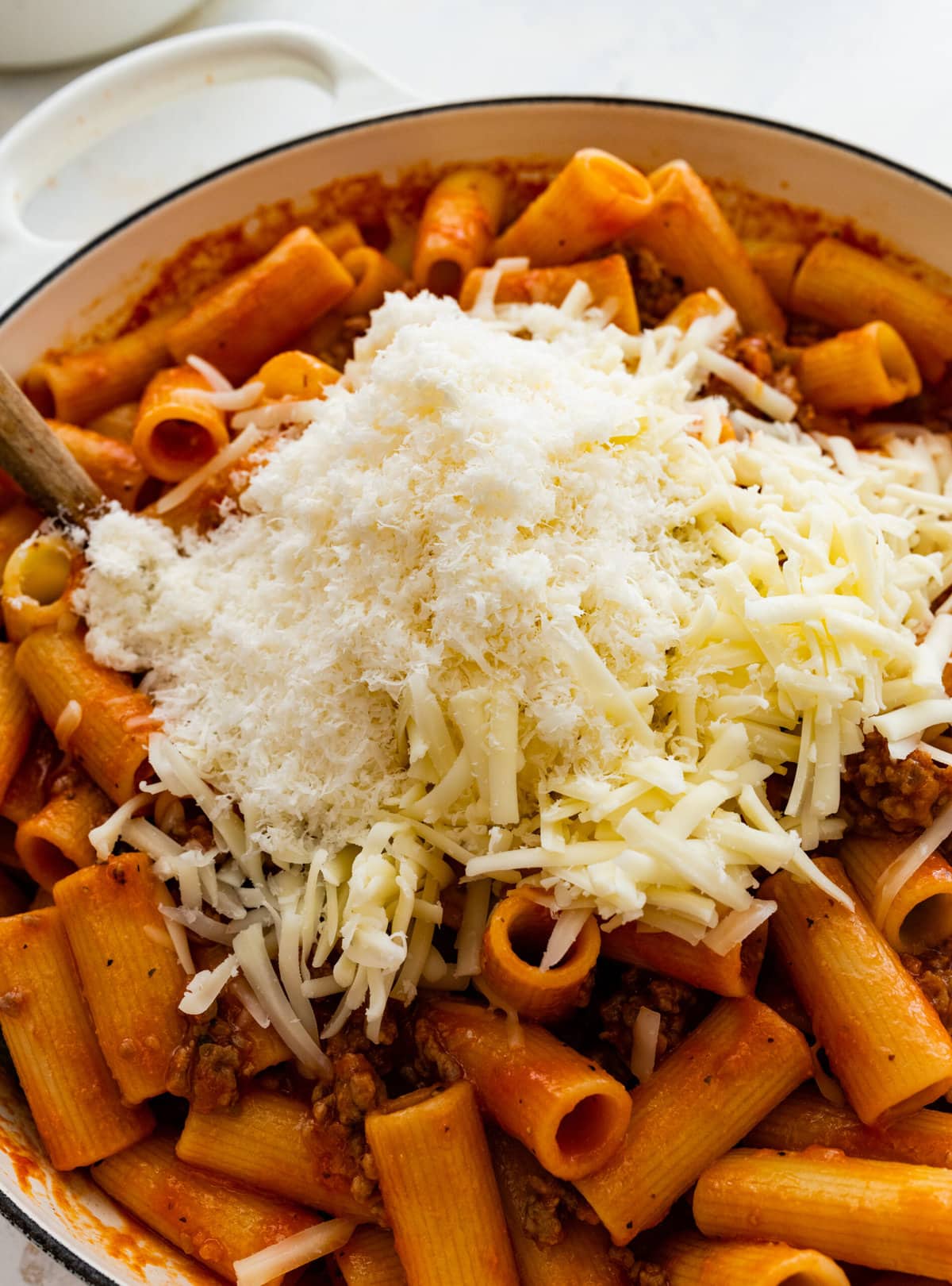How to make classic pasta al forno step-by-step: add half of the cheese