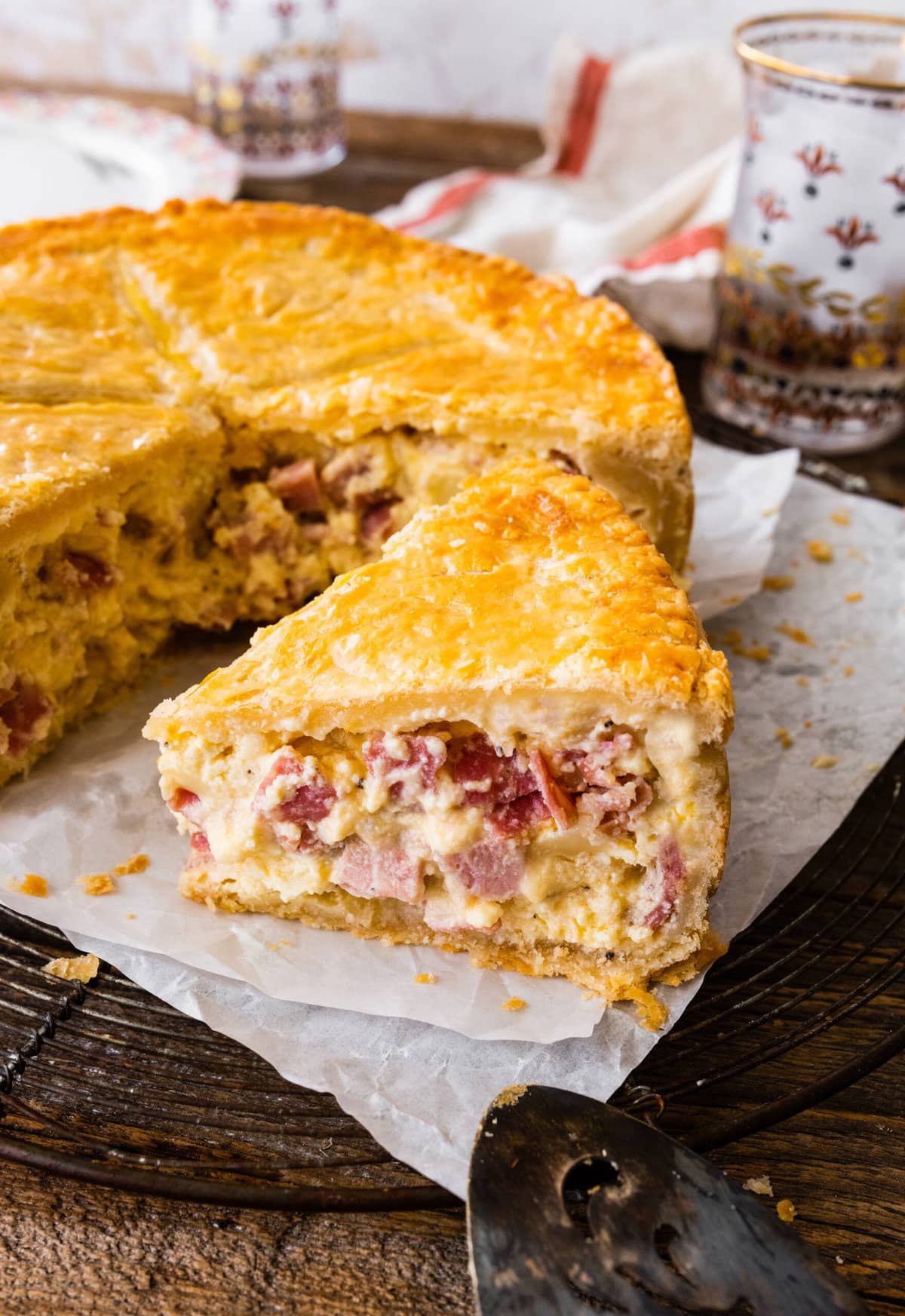 one piece of the pizza rustica pie shown to see the inside layers.