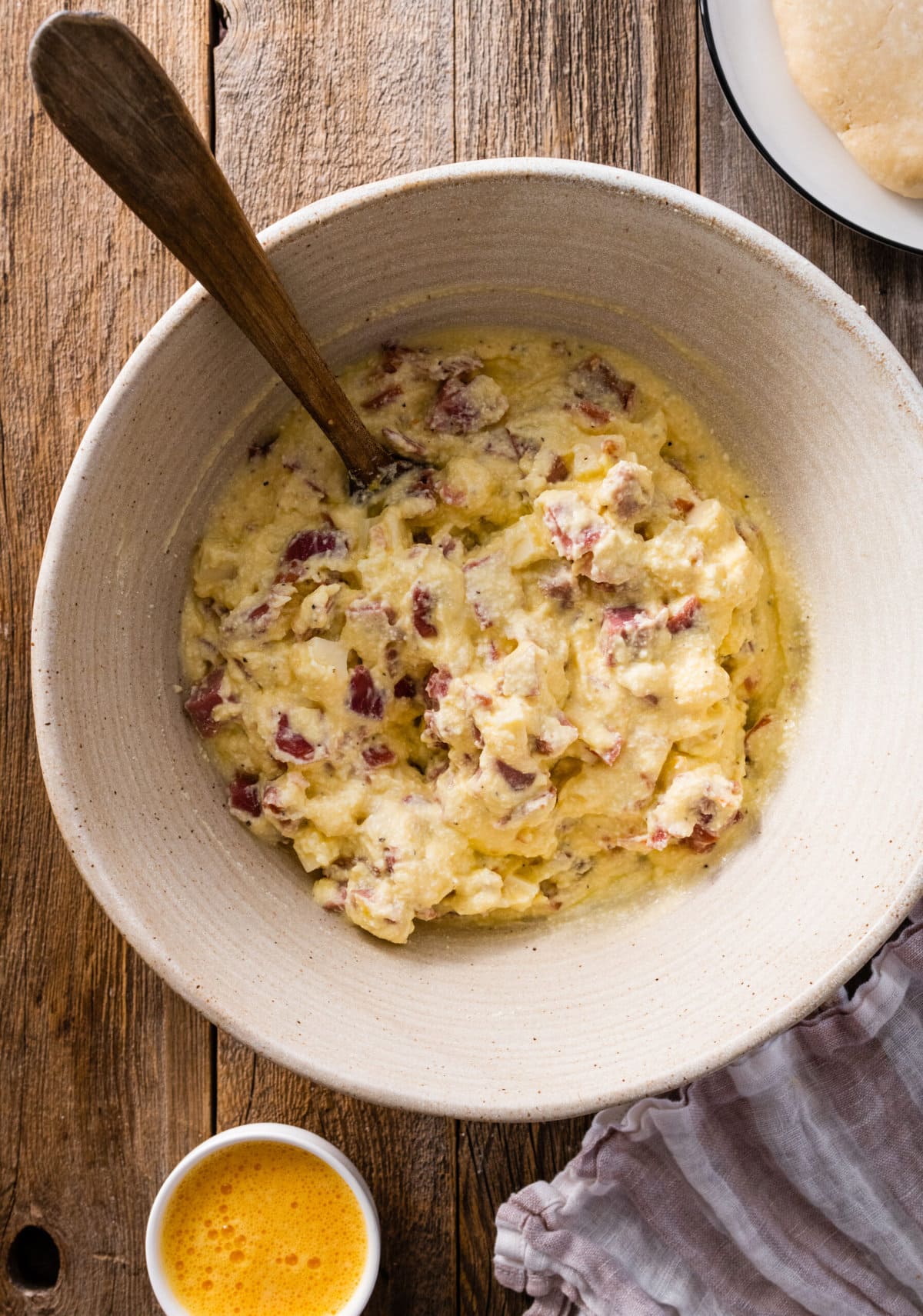 How to make authentic pizza rustica step-by-step: filling ingredients mixed in bowl.