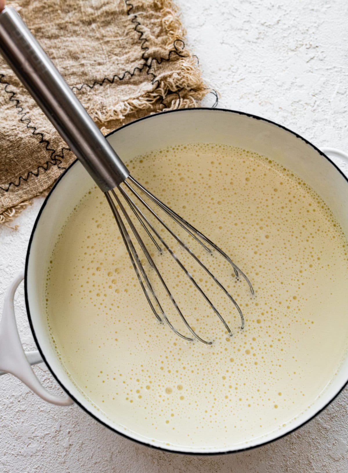 how to make Italian pastry cream step-by-step photos- heating the milk on the stove.