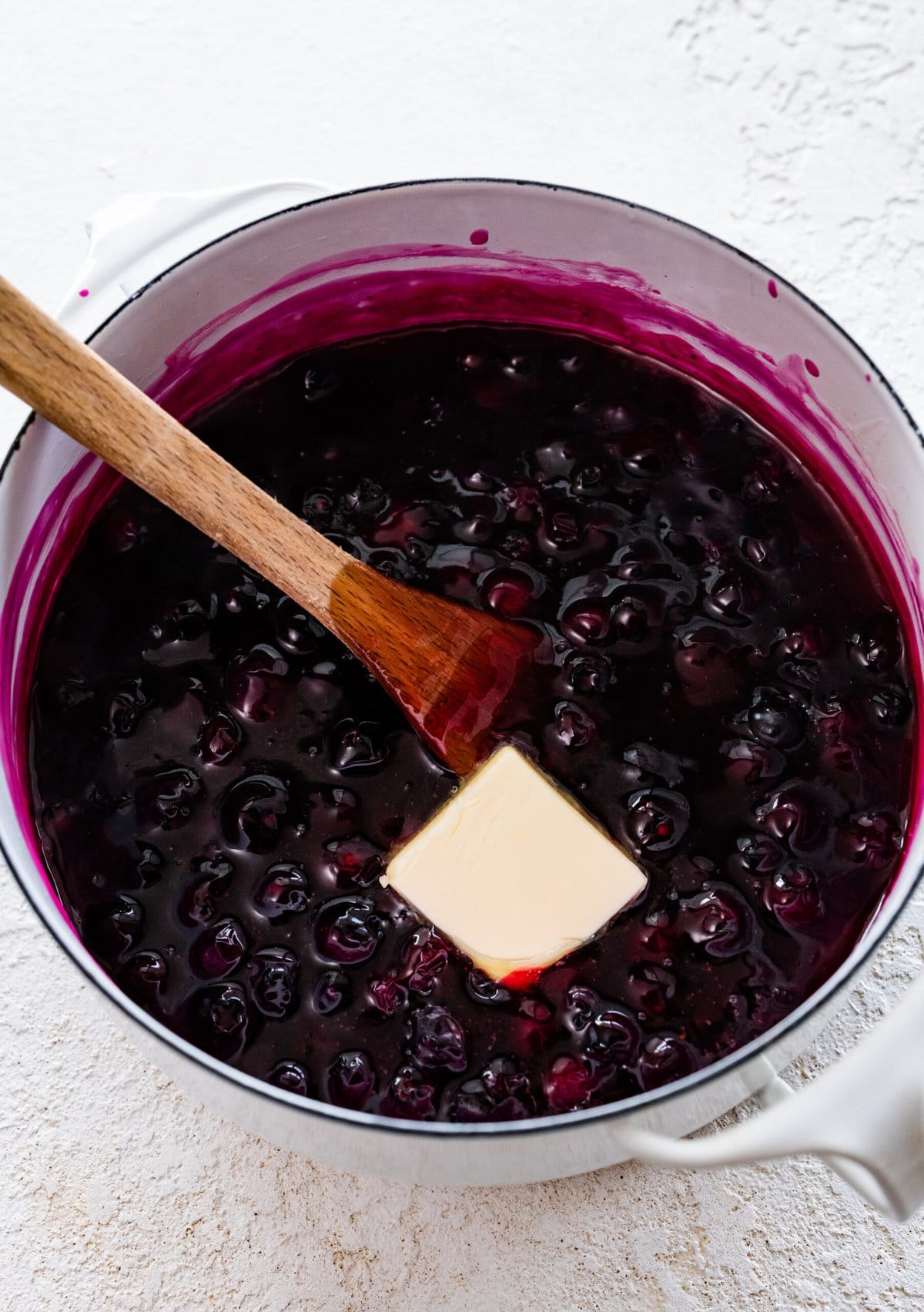 how to make blueberry pancake syrup recipe: add blueberries and cook until thick. Add butter at the end of cooking.