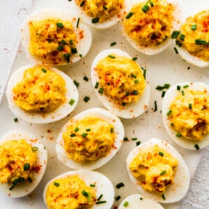 Deviled eggs on a white board.