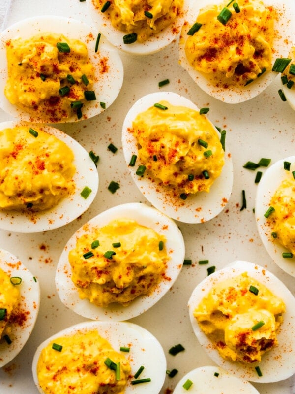 Deviled eggs on a white board.