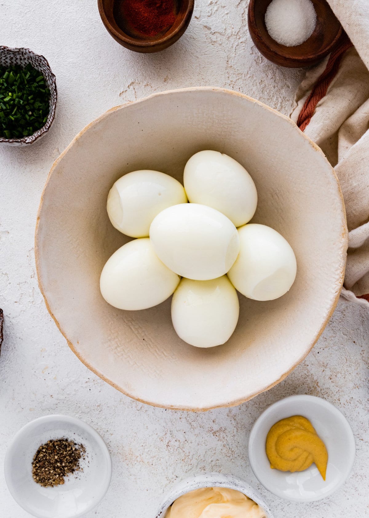 How to make classic deviled eggs step-by-step instructions: peeling the eggs.