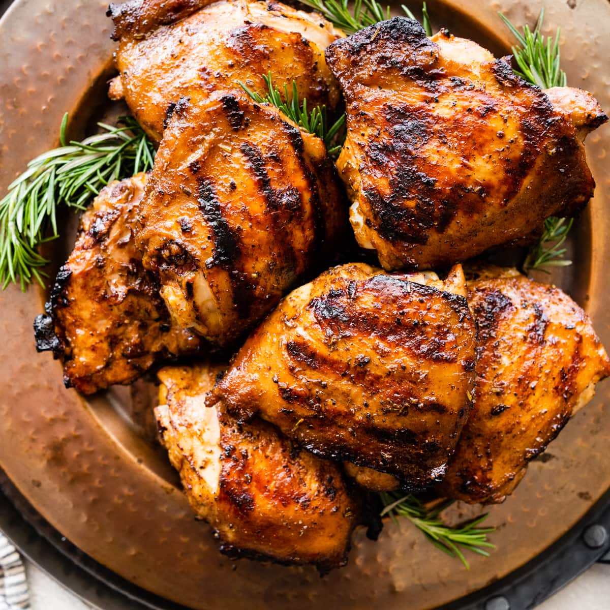 plate of grilled chicken thighs. Cover photo.