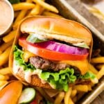 best hamburger recipe ever perfect juicy burger- close up with sauce dripping down the side.