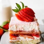 Slice of strawberry tiramisu on a small plate.