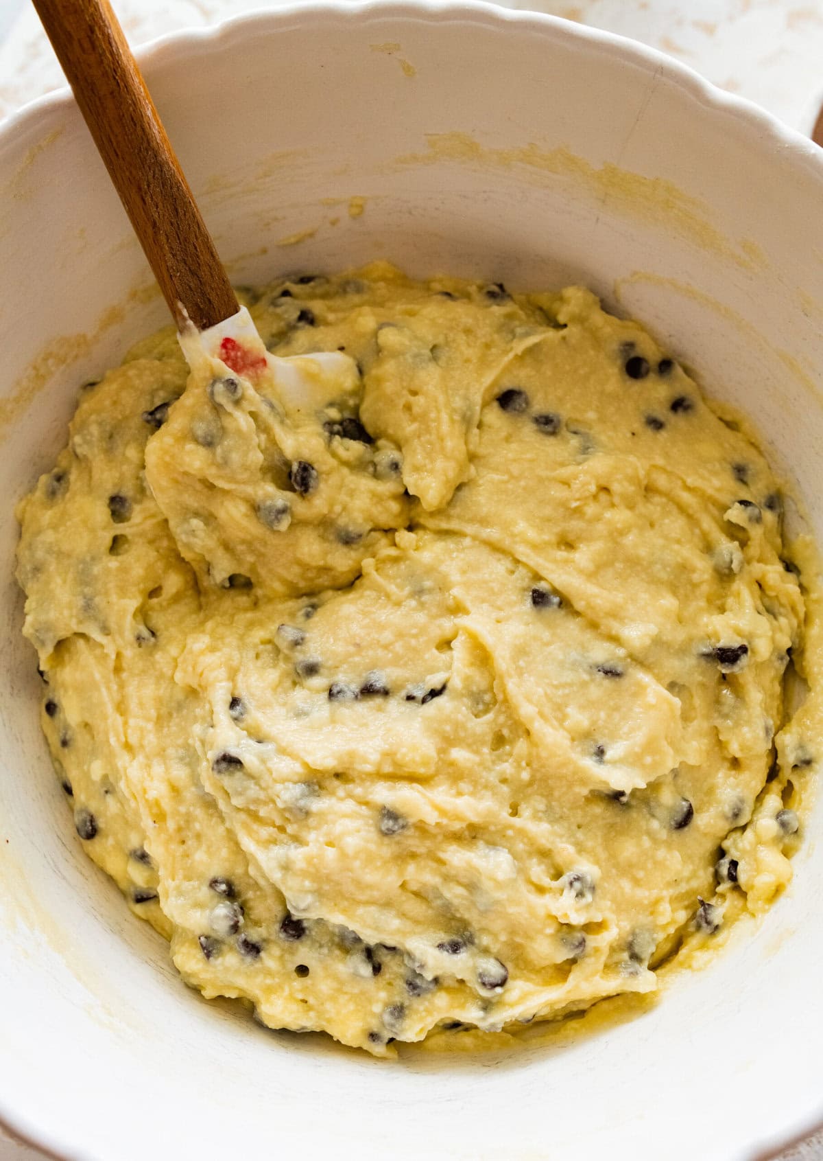 How to make chocolate chip ricotta cake- add the mini chocolate chips to the cake batter. Stir to combine.