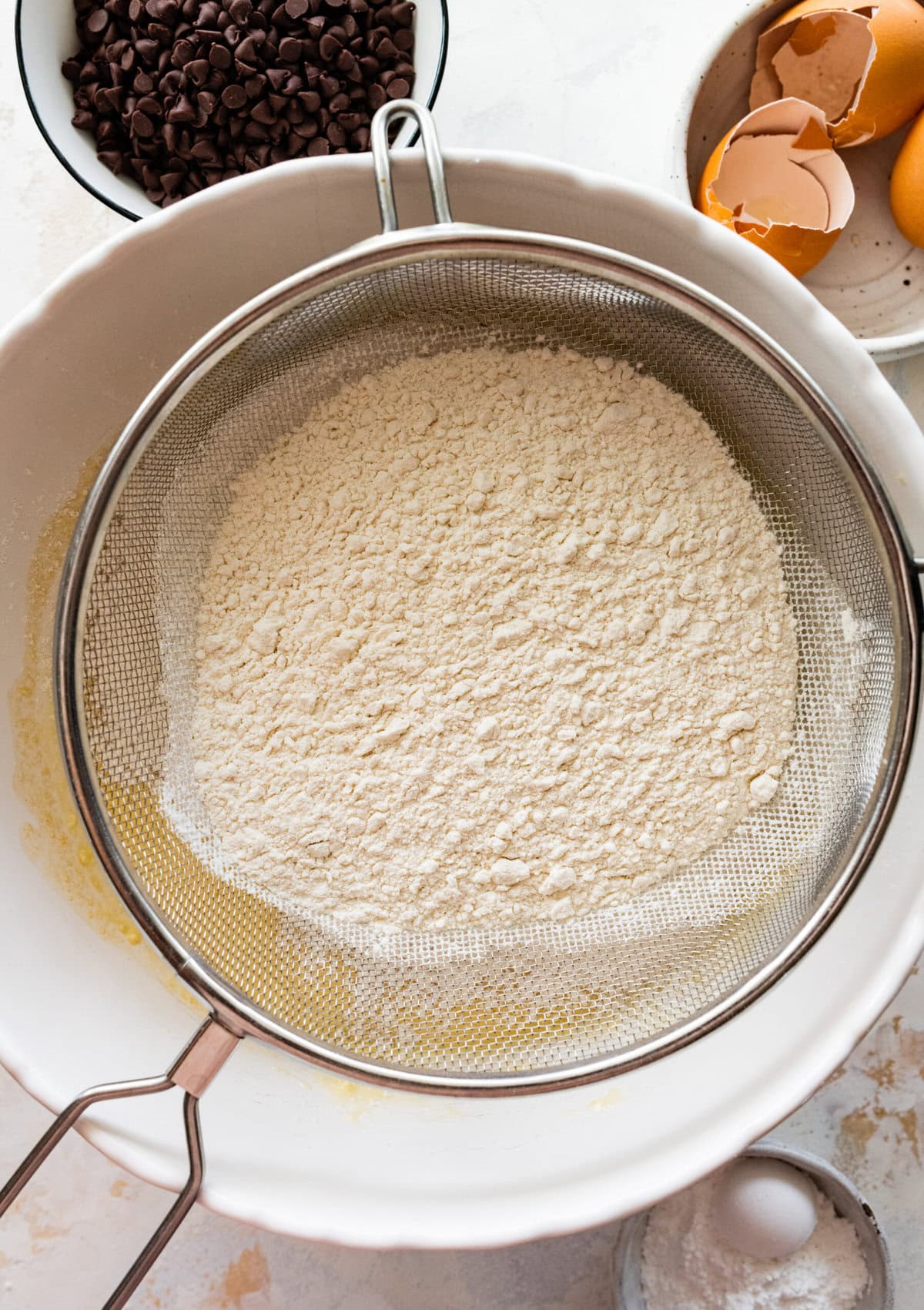 How to make chocolate chip ricotta cake- sift in the dry ingredients over the wet ingredients.