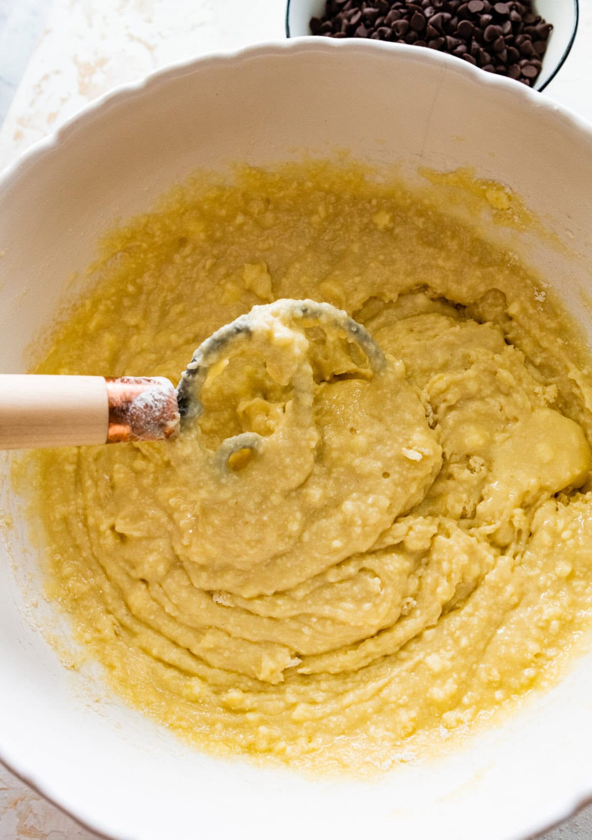 How to make chocolate chip ricotta cake- combine the wet and dry ingredients with a spaulta or dough hook.