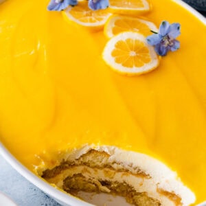 Lemon Tiramisu with lemon curd missing a scoop.