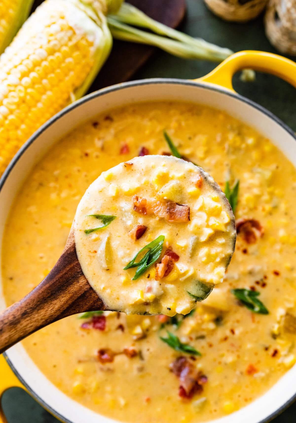 A ladle of the corn chowder soup from the soup pot.