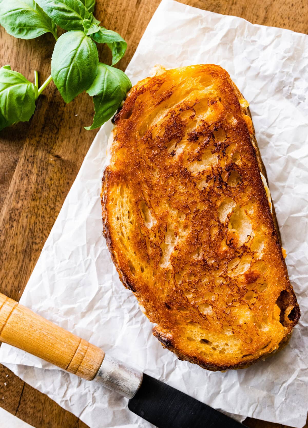 grilled cheese sandwich on a wooden board.