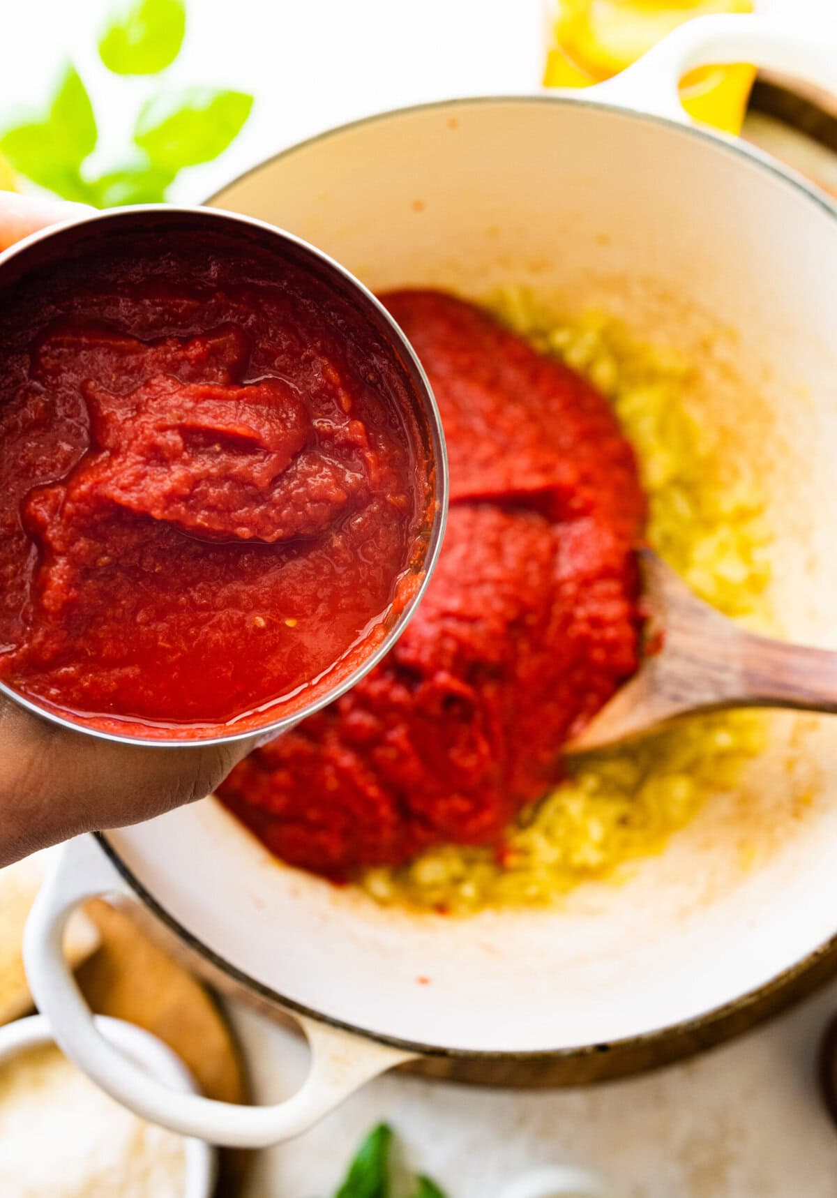 How to make creamy tomato soup with grilled cheese sandwich recipe- add the canned tomatoes to the pot.