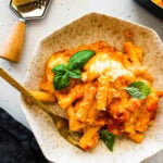 plate with the baked ziti and a fork ready to eat.