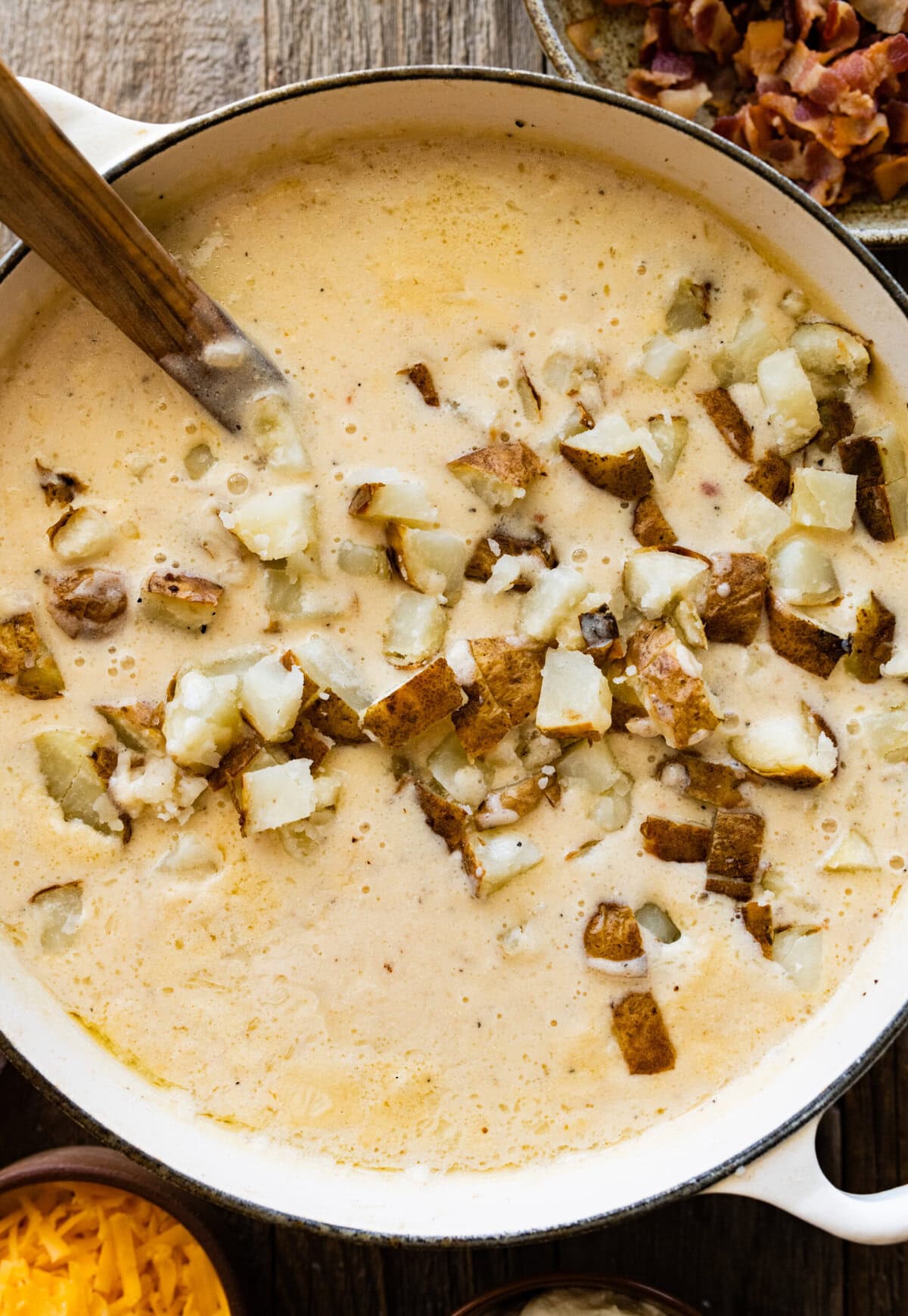 How to make Best Outback Baked Potato Soup Copycat Recipe - add the potato chunks into the soup.