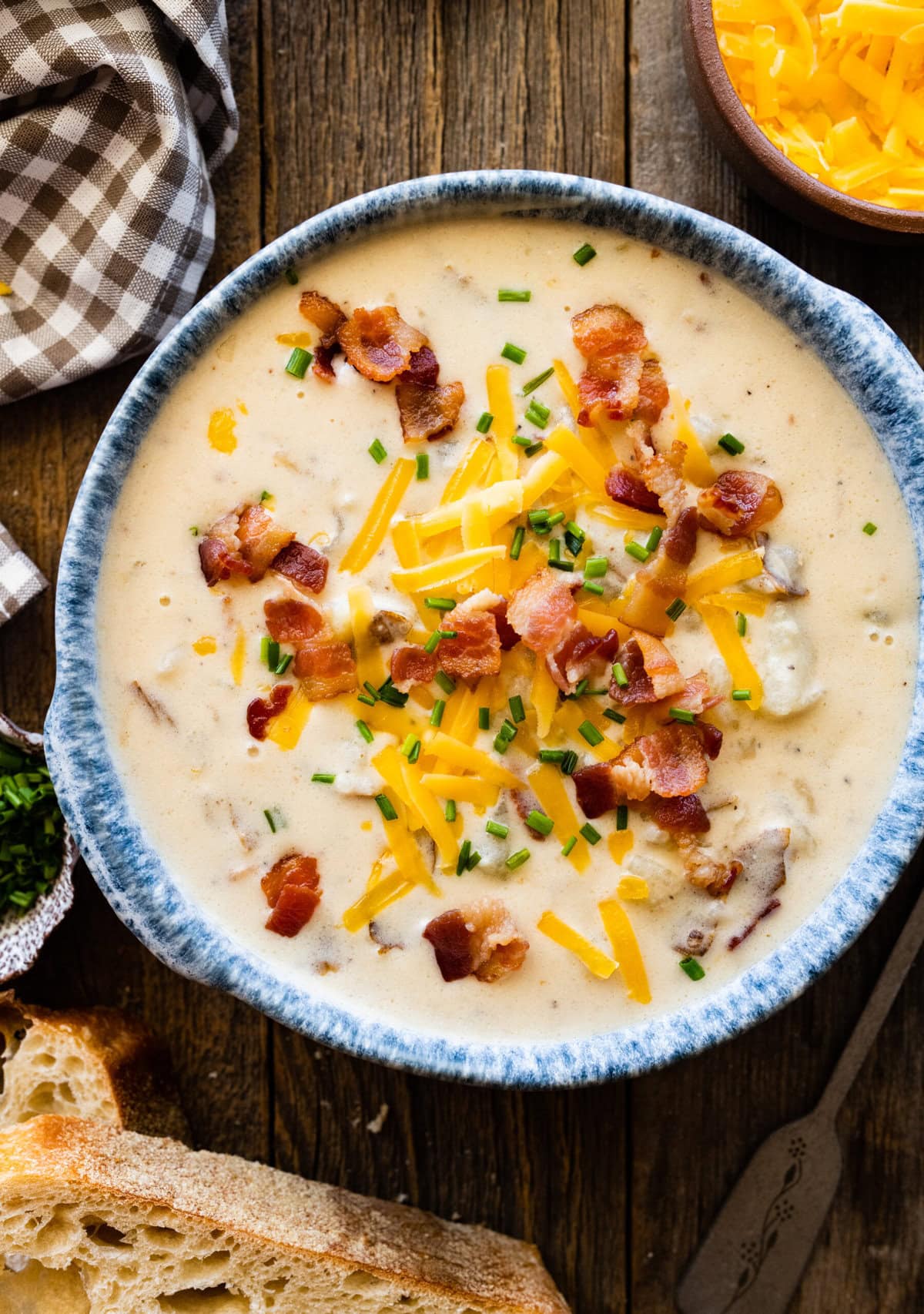 Outback baked potato soup recipe in a bowl with a blue rim. 