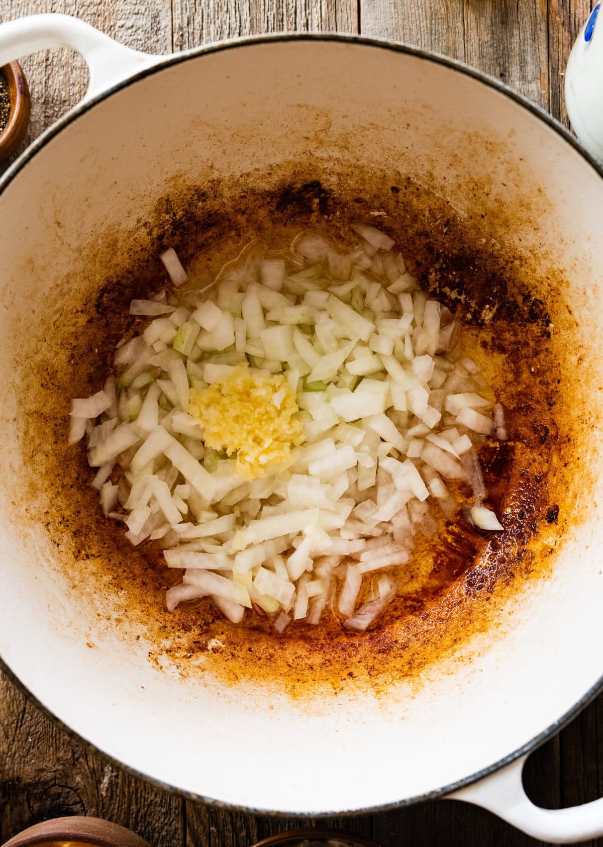 How to make Best Outback Baked Potato Soup Copycat Recipe - add onions and garlic to the pot with bacon grease.