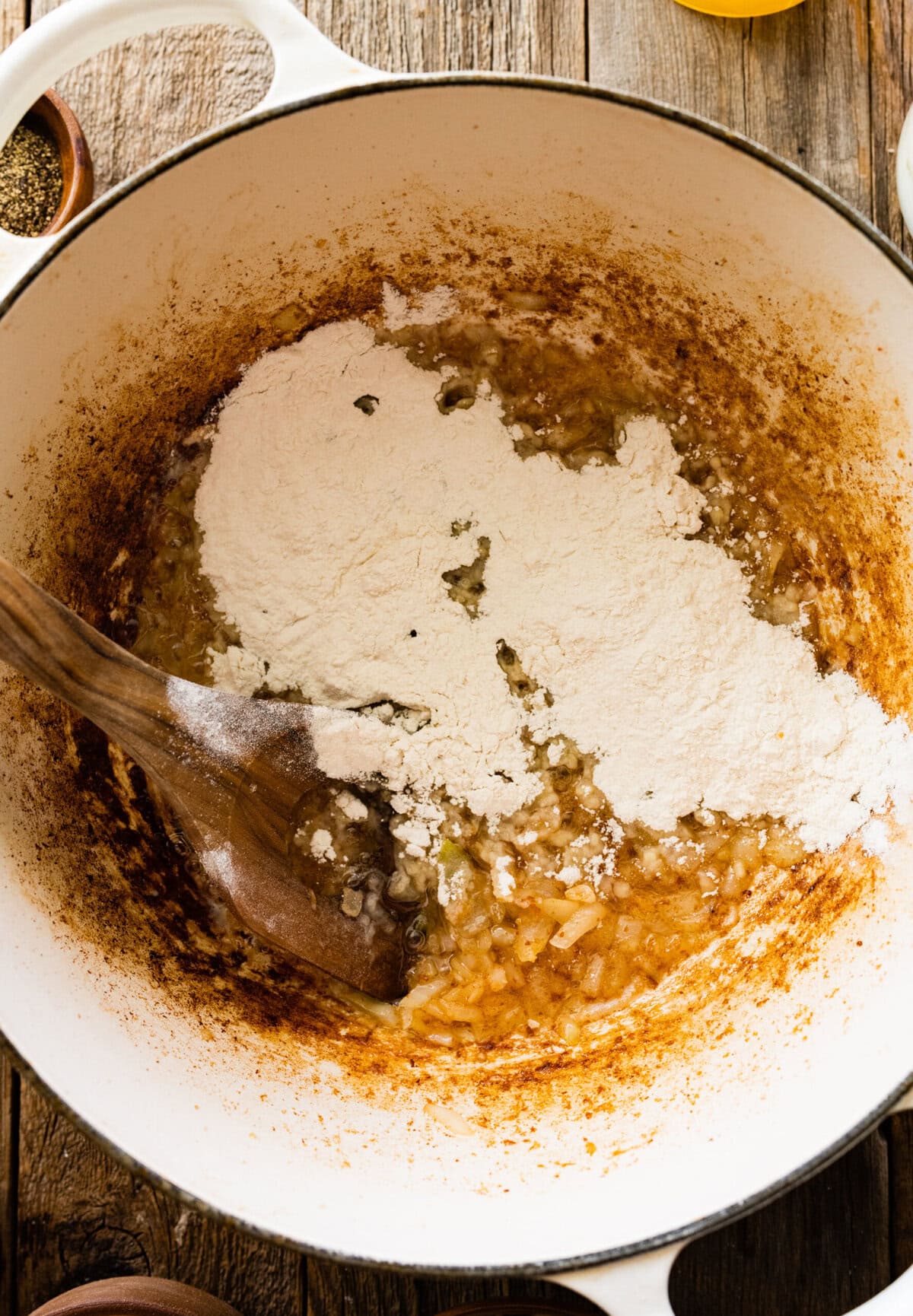 How to make Best Outback Baked Potato Soup Copycat Recipe - add flour to the pot and stir to combine.