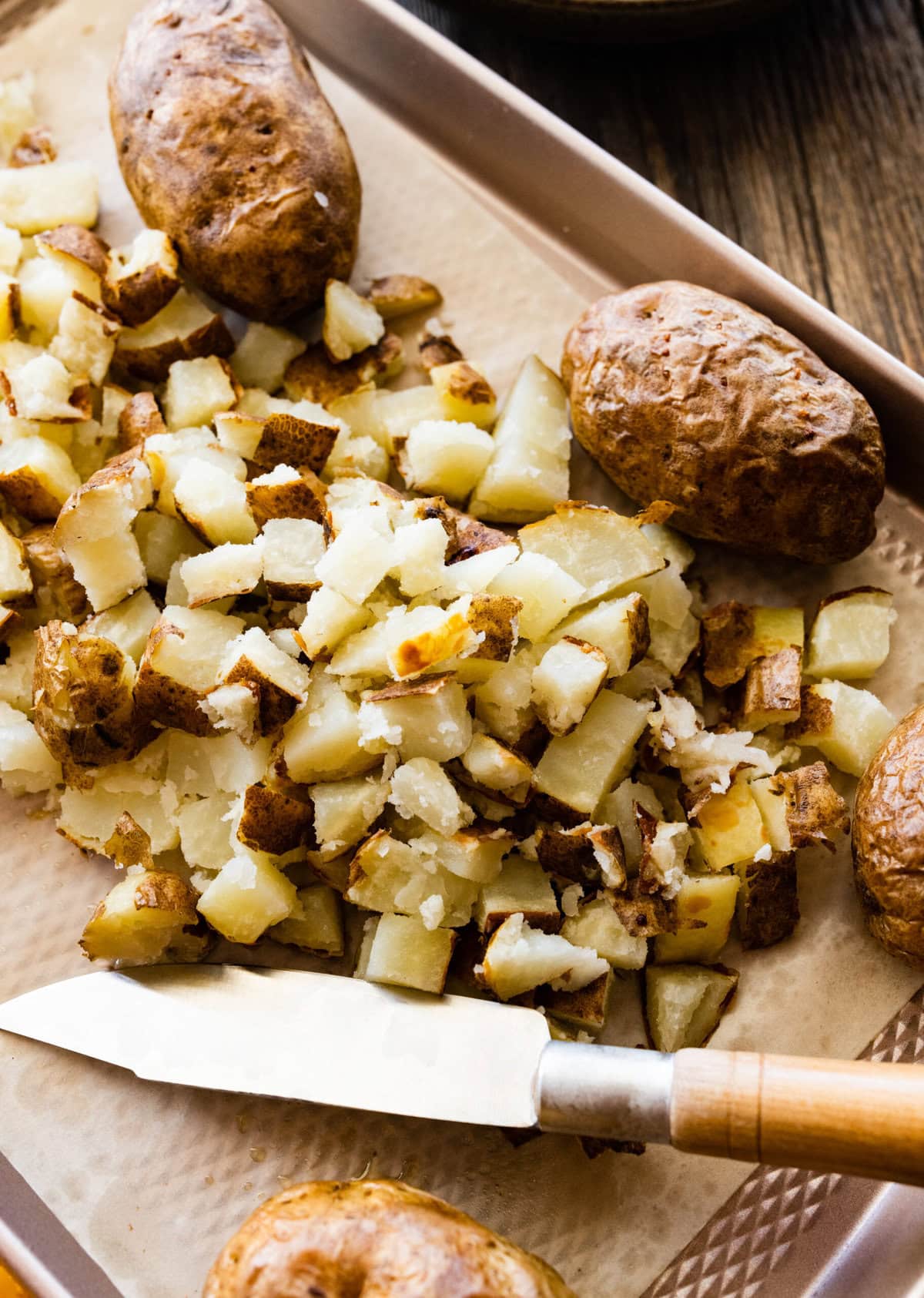 How to make Best Outback Baked Potato Soup Copycat Recipe - cut the baked potatoes into chunks.