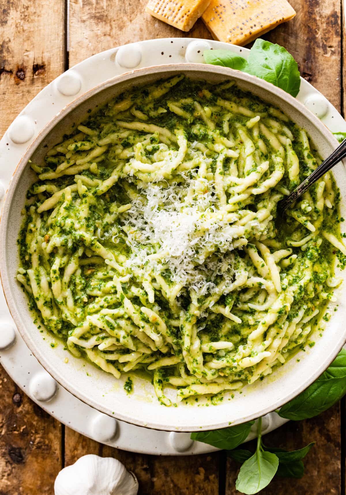 Basil pesto tossed with trofie pasta. Served with parmigiano on top.