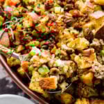 Ciabatta bread stuffing with sausage and chestnuts recipe. On serving spoon.