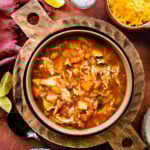 Bowl with wooden handles of Mexican chicken soup.