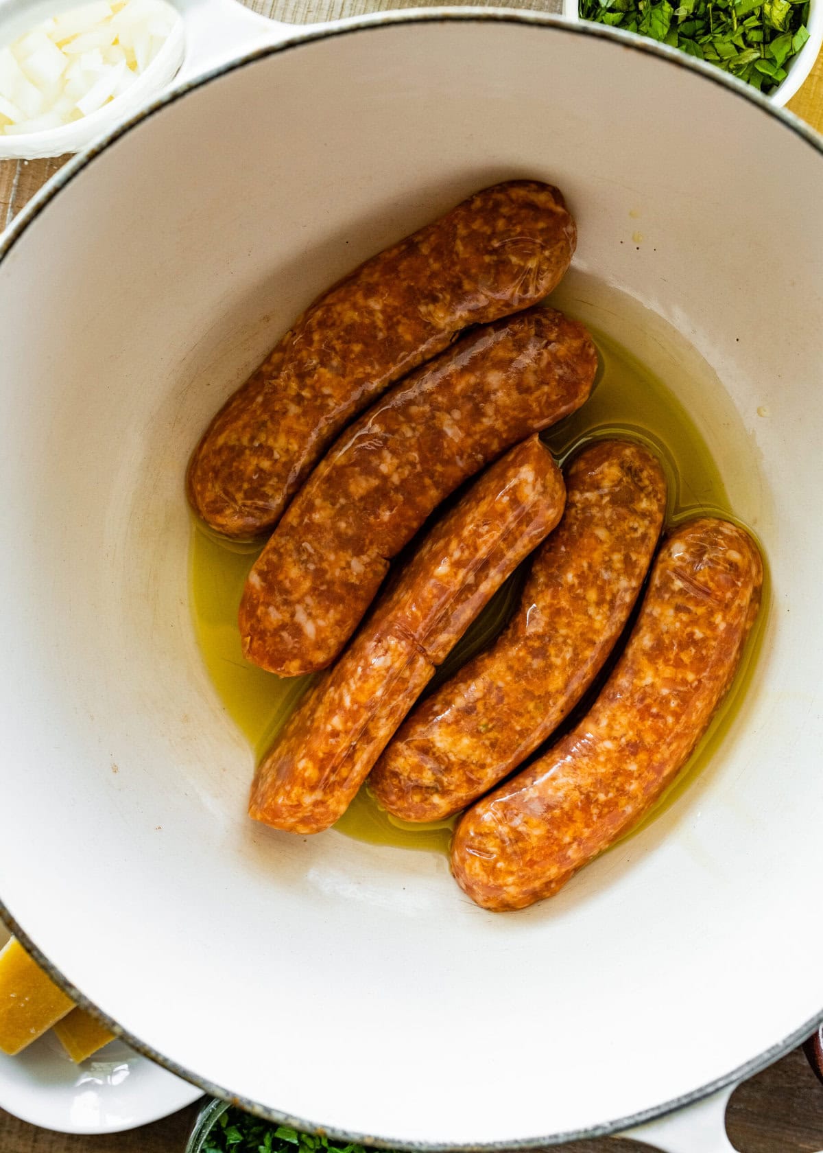 How to make sausage lentil soup (Italian recipe) step-by-step: add the sausage to the pan without the casing.