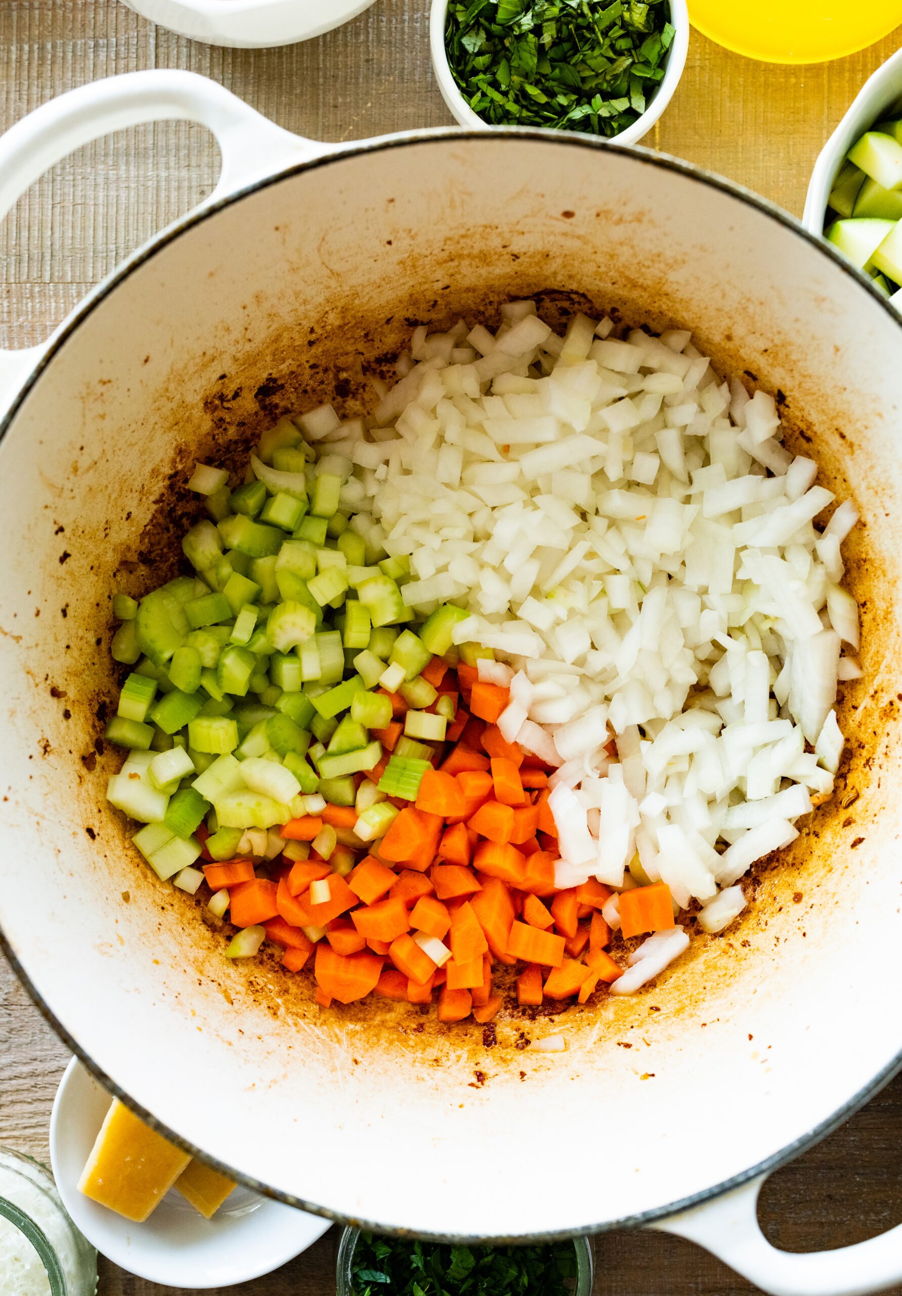 How to make sausage lentil soup (Italian recipe) step-by-step: add the onions, carrots, and celery to the pan.