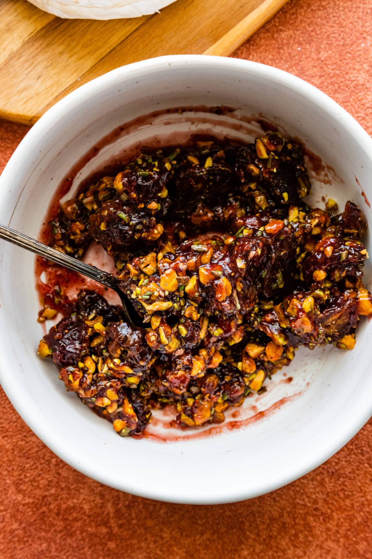 How to make baked brie recipe step-by-step instructions: mix all the topping ingredients.
