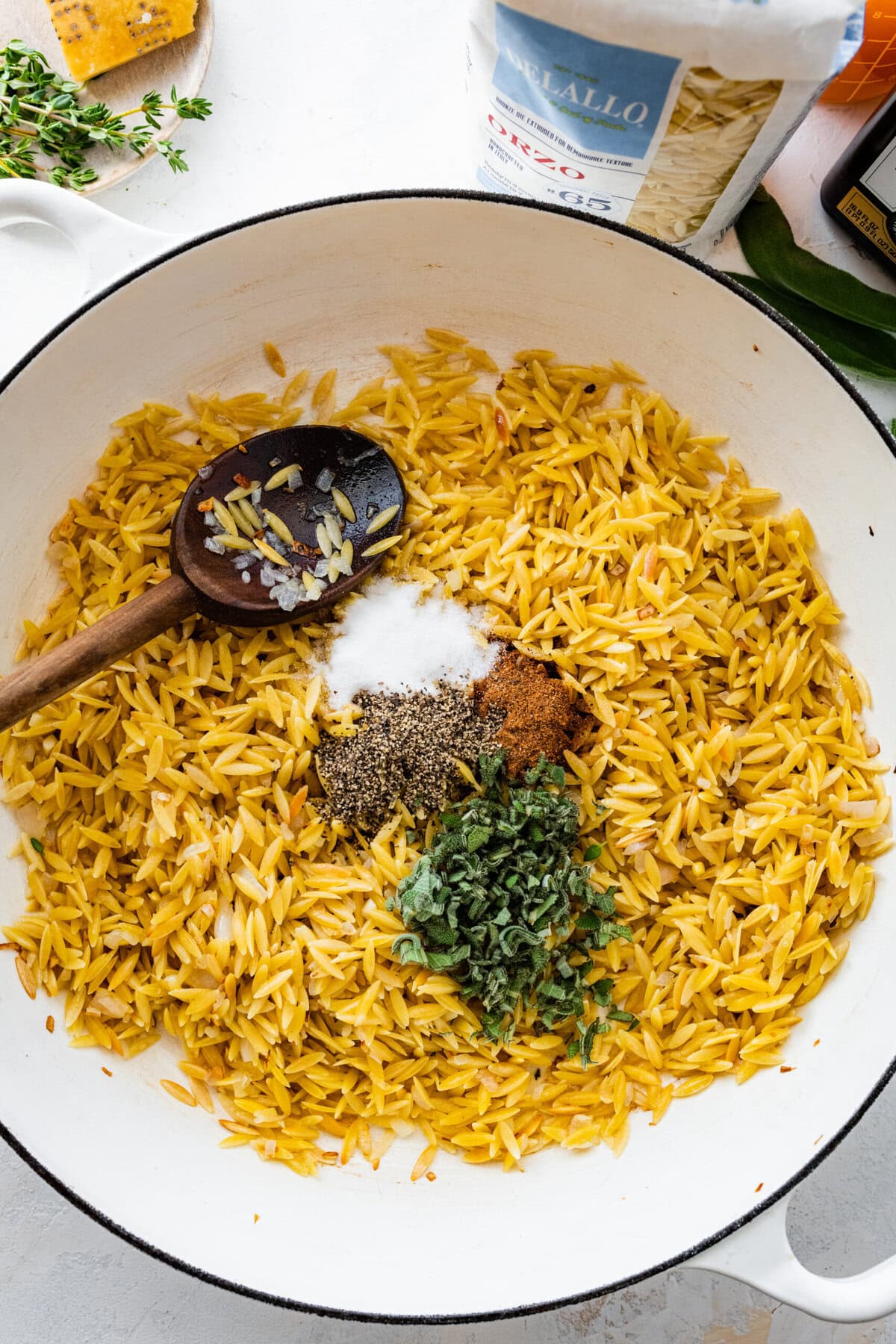 How to make Butternut Squash Orzo Recipe Step-by-step: add the seasonings to the orzo.